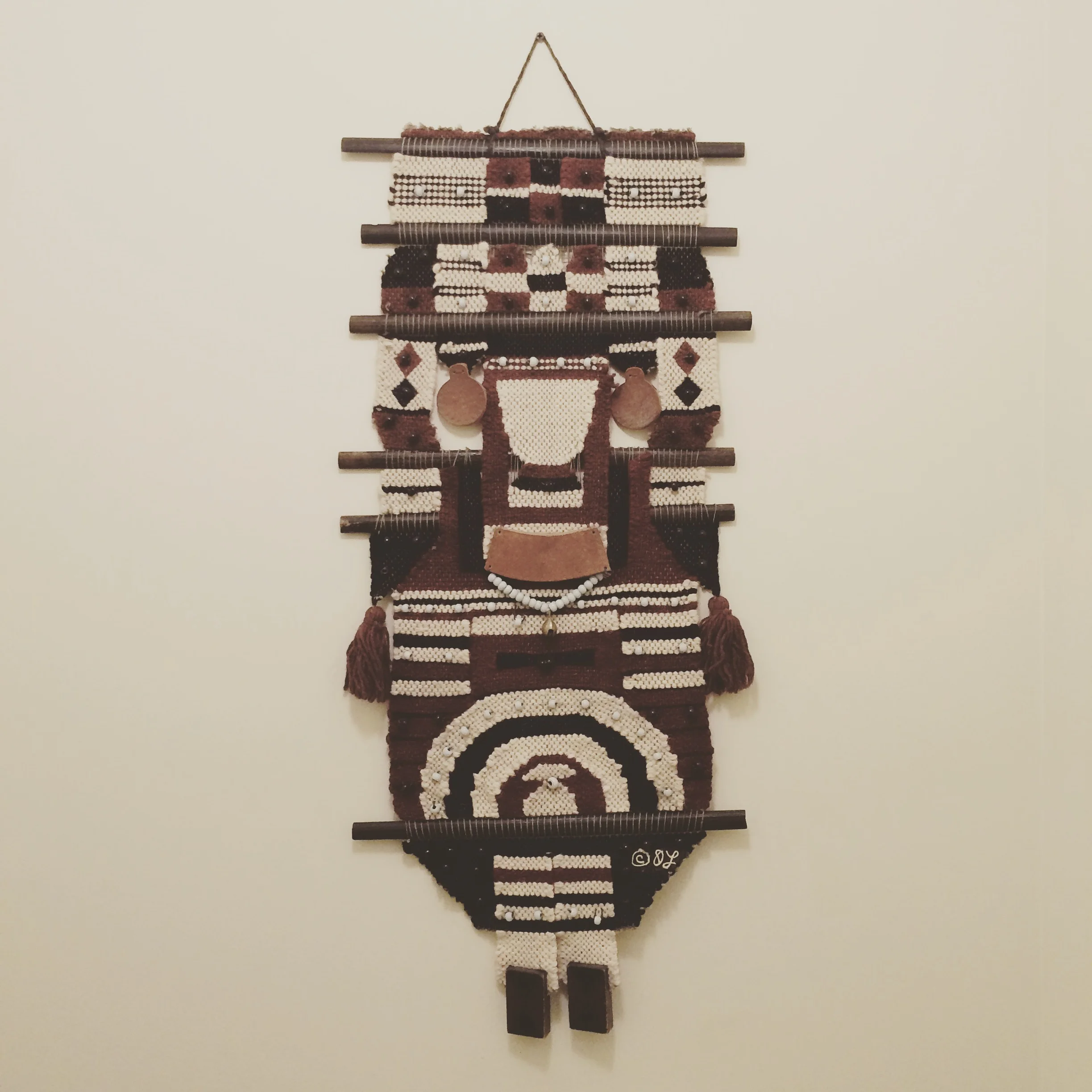 You may think I spotted this gem alongside Zeisler's work in a museum, right? Nope, it was totally hanging above a toilet in my hostel. Fiber art is everywhere these days!