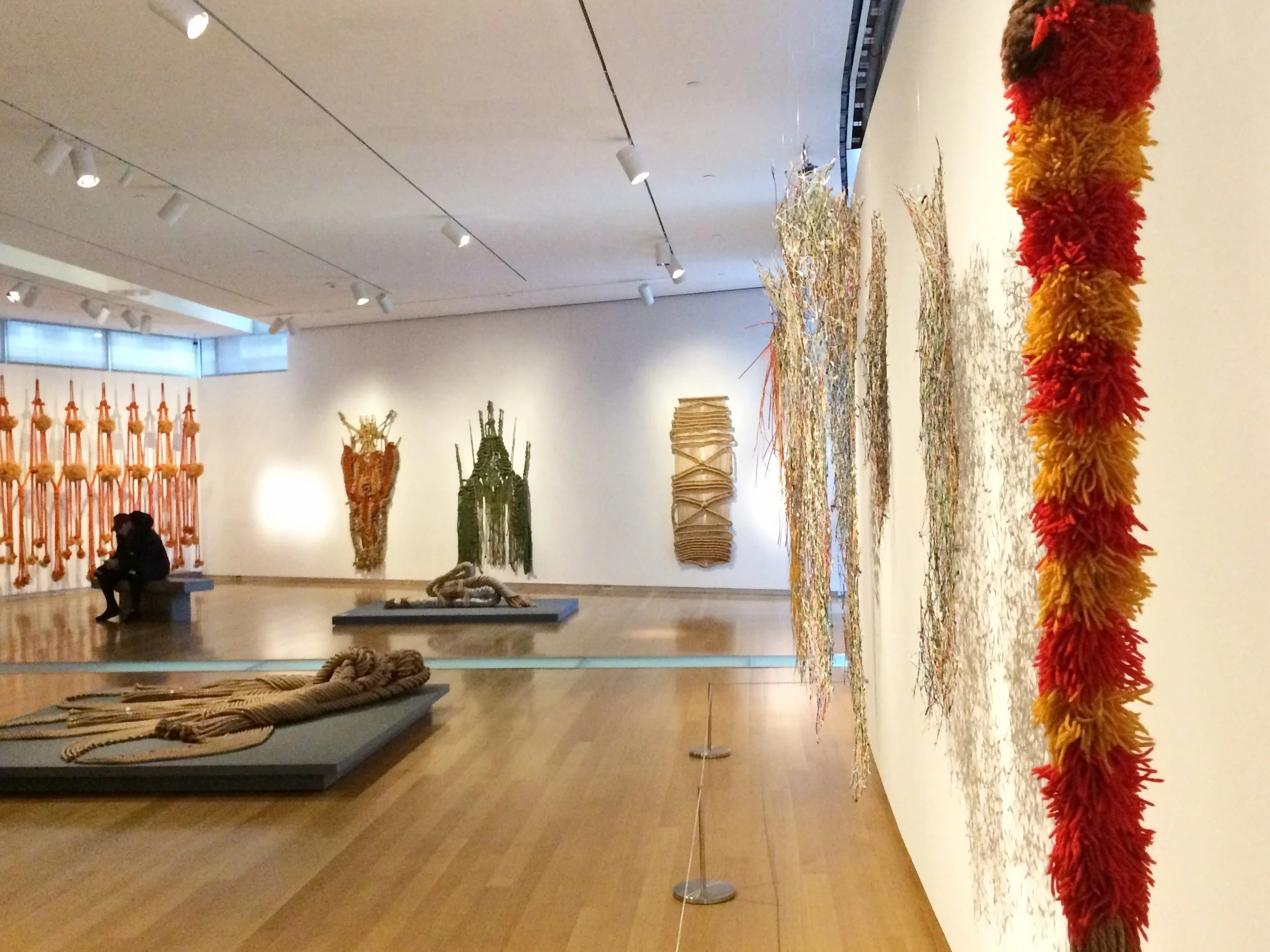 Installation view of Françoise Grossen Selects at Museum of Arts and Design, New York. The flames of yarn in the foreground are by my dissertation artist, Claire Zeisler!