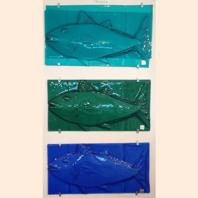 Fused glass tunas made with a fiber and sand mold, slumped up over 1400 degrees for 36 hours to achieve desired effect. Other colors and sizes available. Only at SwellColors