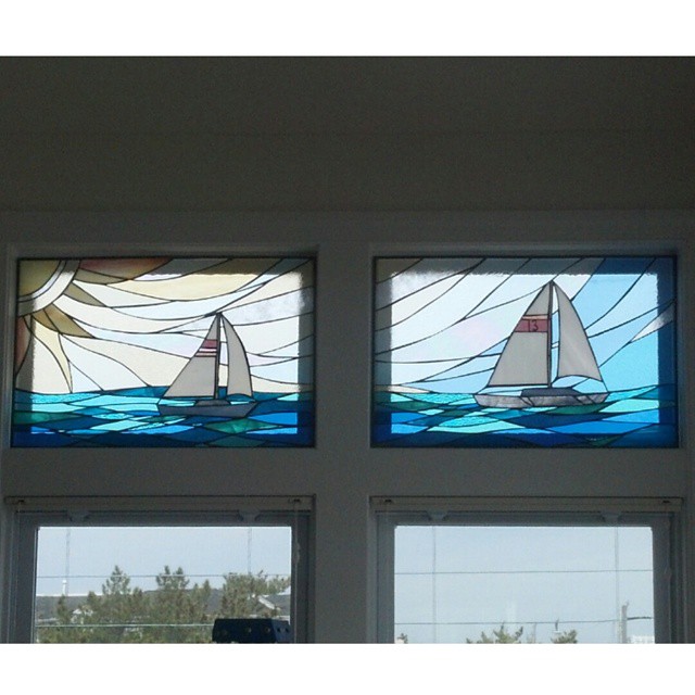  Two stained glass panels installed together to create one scene. 