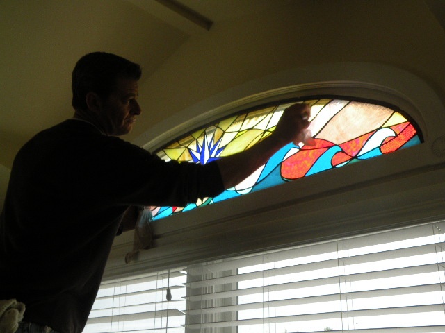  Compass Rose of Cedars Installation  We design, fabricate, deliver, and install all shapes and sizes of stained glass for your home or business. Pictured here is our skilled craftsman putting the final touches on this newly installed panel at a home