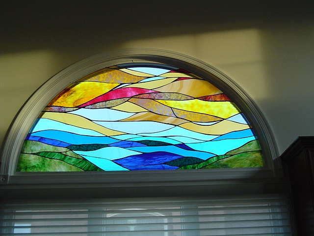  "Earth, Ocean, Sky" kitchen  Stained Glass  Two similar panels were created for this residence (one for the kitchen and one for the bathroom). The home owner wanted continuity from room to room for the exterior views of his house. When the house is 