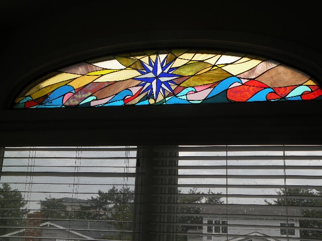  Compass Rose of Cedars  stained glass  61" x 17"  The compass rose is a tool used by ancient mariners to navigate the stormy and calm seas to find faraway lands and then guides them safely back home. 