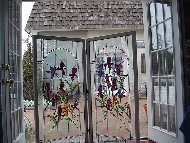  "Irises"  Stained Glass  This panel was originally designed to be a screen for a large wine cooler. Once it was completed, however, my clients decided it was too pretty to place where they wanted to put it. The panels are whitewashed and framed in o