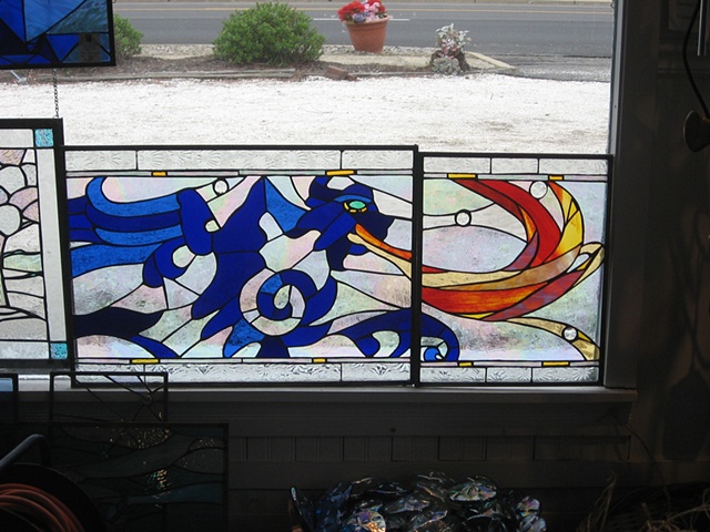  "The Dragon" partial view pre-intallation  Stained Glass  This is a partial, pre-installation view of "The Dragon". The design for the three panels in this series was inspired by the tiles in the home owner's powder room. They are installed in a his