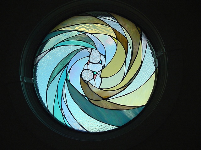  Yin Yang  Stained Glass  This round window is a focal point when inside the house. It compliments the warm colors and philosophy of the home owners.  Held in private collection in Peahala Park, NJ  Designing and fabrication typically are all done in