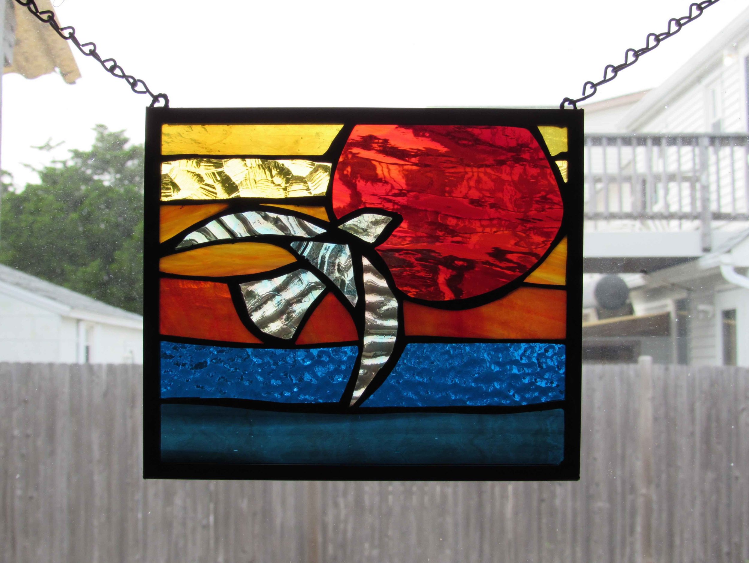 Custom Stained Glass Window.Bird Flying Into Sunset at Sea 2.jpg