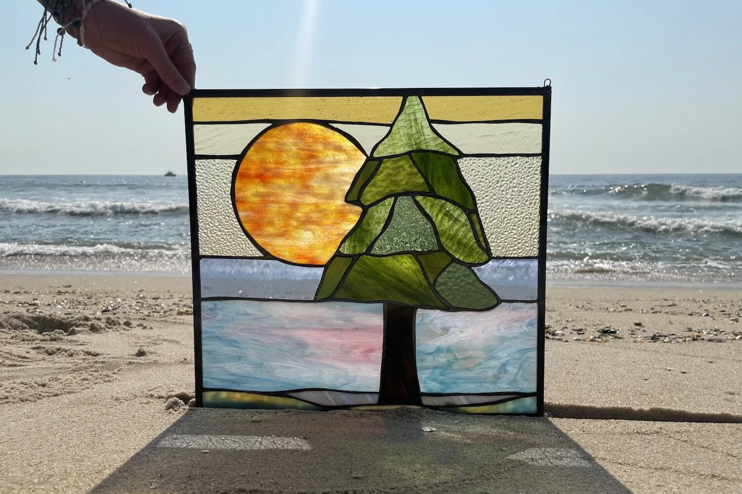 cedar tree and sun scene custom stained glass art