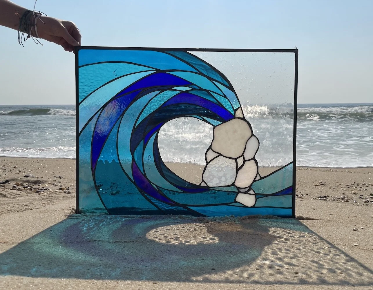 large blue wave swell stained glass