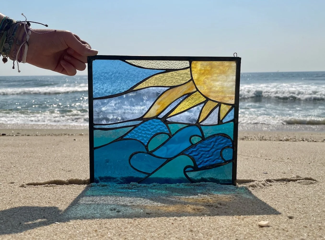sun and waves stained glass window