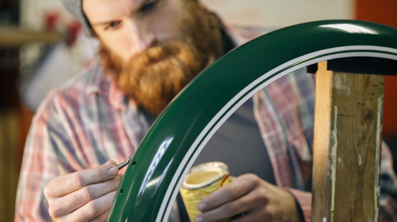 Ryan applying the hand-painted pinstripe to a fender. 