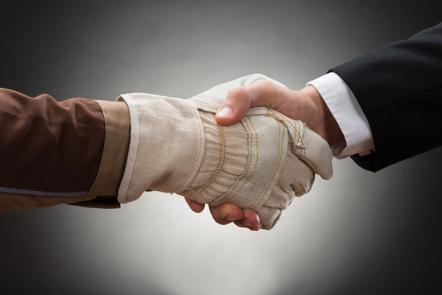 photodune-11709335-worker-shaking-hand-with-businessman-m.jpg
