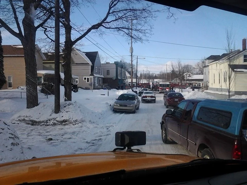 A perfect example of when Even/Odd Parking rules were ignored. This photo was taken by resident Luci Anderson of Fire Trucks that were unable to respond quickly to a business fire (Sam's Party Store) on 2/27/2014 due to cars being parked on both sides of the street. This is a safety hazard for homeowners and business owners alike as the Emergency Vehicles trying to respond cannot pass to get to the emergency, people could possibly not get help in a timely manner and in the case of a fire, it could spread to other buildings if not contained quickly. In a worst case scenario, a person or persons could be hurt or killed because of it. There have been multiple instances in the news where this was the case. Examples: Fox 17: Multiple Crews Respond to Party Store Fire