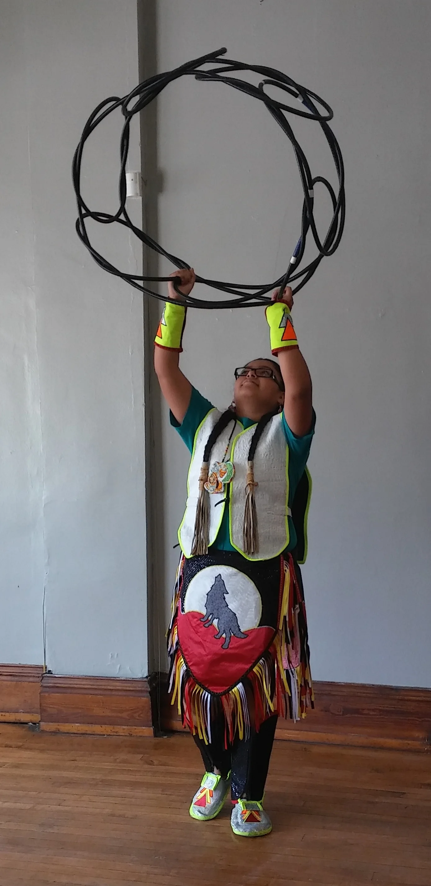 One of our young residents performing a native american hoop dance.