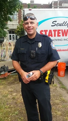 WGNO Community Police Officer Leonard at the Steepletown Preschool playground build.