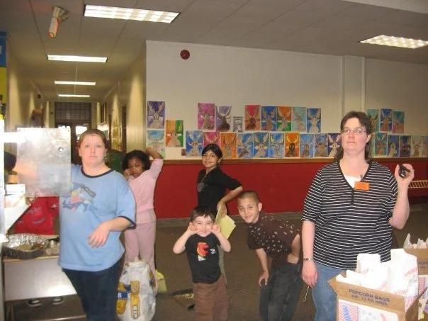 One of our staff members volunteering at Stocking making popcorn for students - 2009
