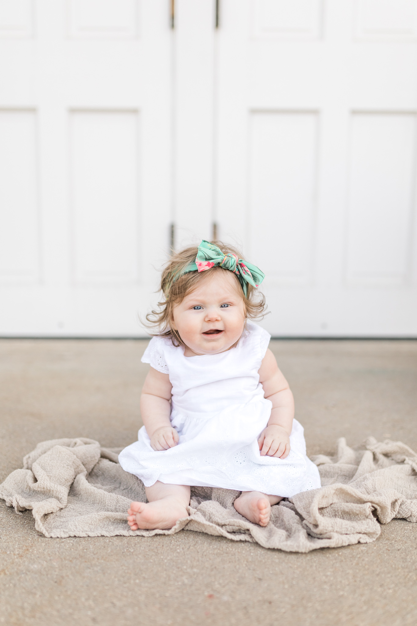 6 month baby girl milestone session at a greenhouse