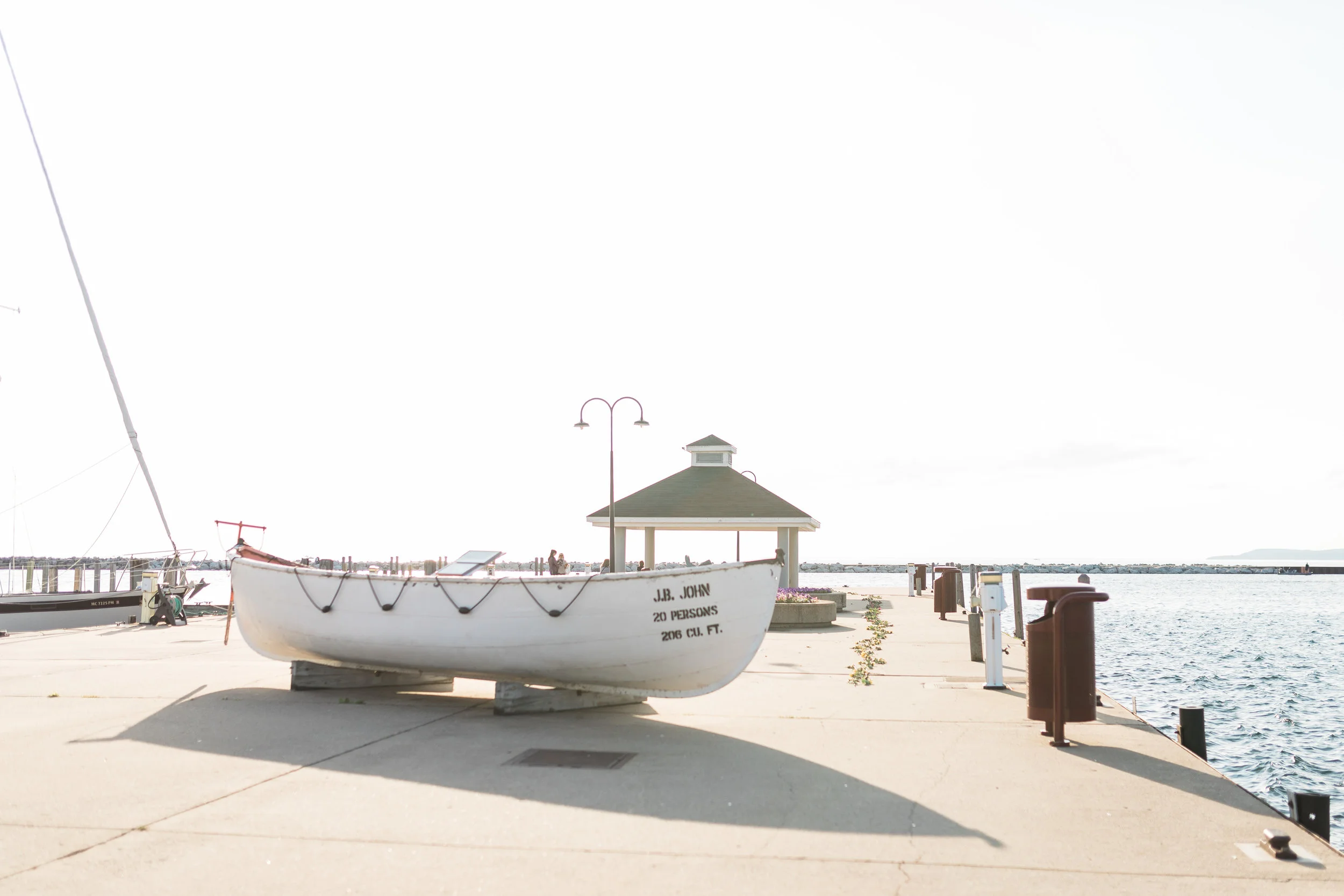 Romantic Petoskey Michigan Proposal on the Pier | How He Asked | She Said Yes | Laurenda Marie Photography