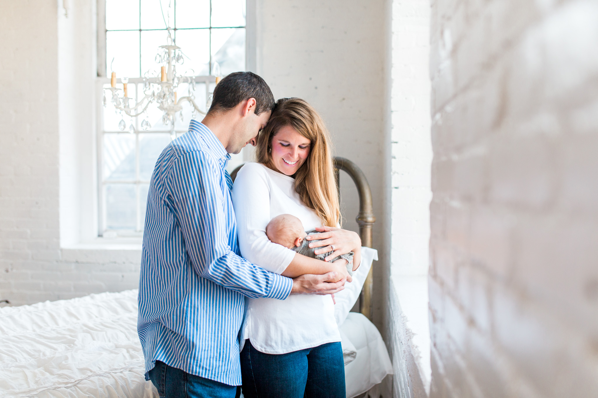 White Studio Newborn Lifestyle Session with New Parents | Laurenda Marie Photography | Grand Rapids, Michigan