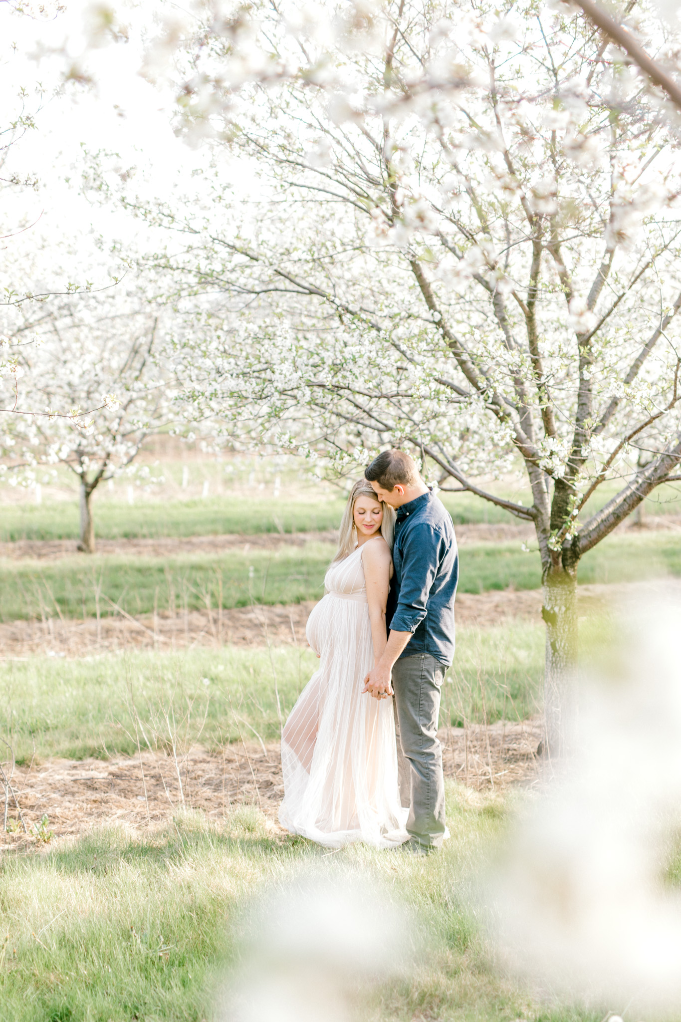 Spring Cherry Blossom Maternity Session in Mattawan Michigan | Light and Airy Maternity Photos | Couples Maternity | Laurenda Marie Photography