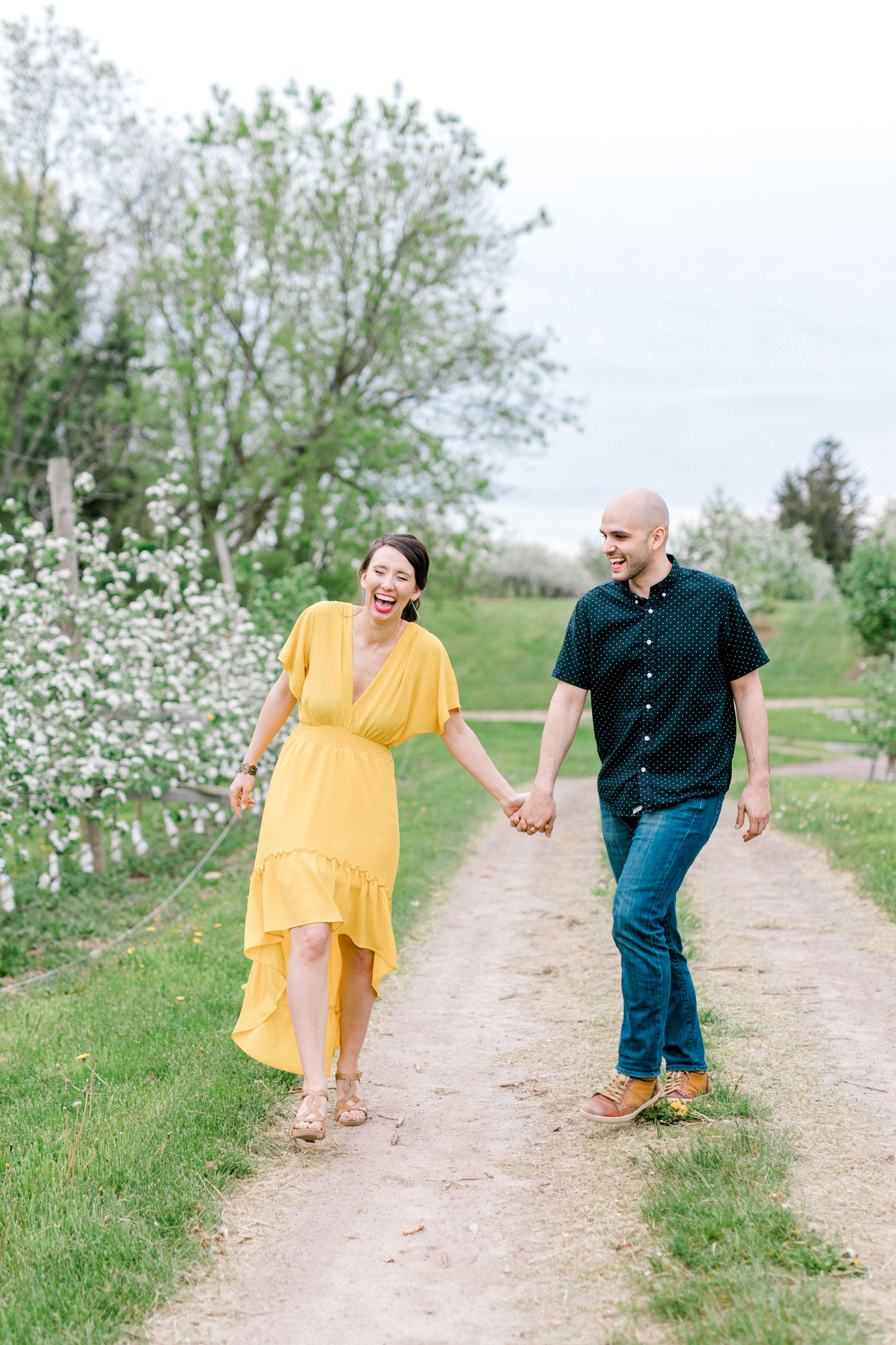 Spring Apple Blossom Engagement Session at the Orchard | Engagement Bouquet | Mustard Yellow Dress | What to Wear to Your Engagement Session | Grand Rapids Wedding Photographer