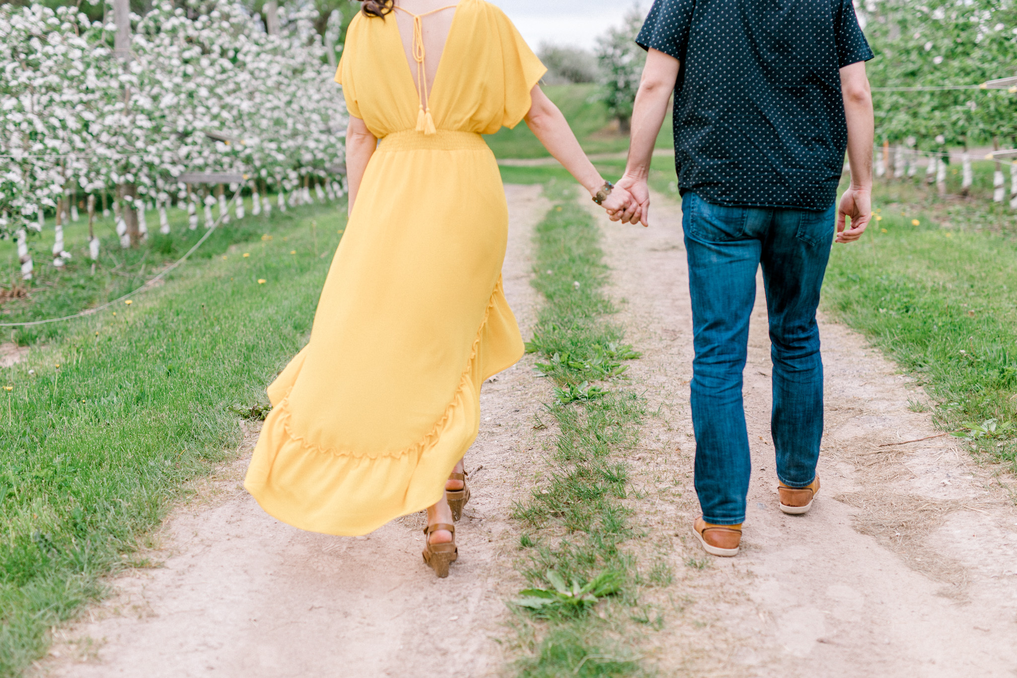 Spring Apple Blossom Engagement Session at the Orchard | Engagement Bouquet | Mustard Yellow Dress | What to Wear to Your Engagement Session | Grand Rapids Wedding Photographer