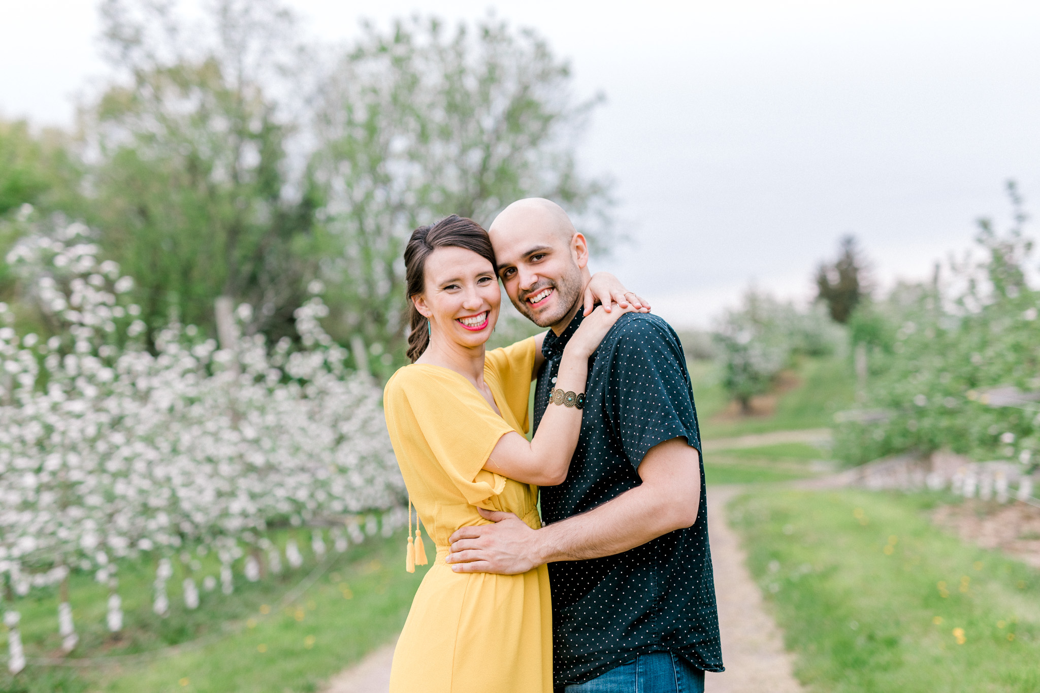 Spring Apple Blossom Engagement Session at the Orchard | Engagement Bouquet | Mustard Yellow Dress | What to Wear to Your Engagement Session | Grand Rapids Wedding Photographer