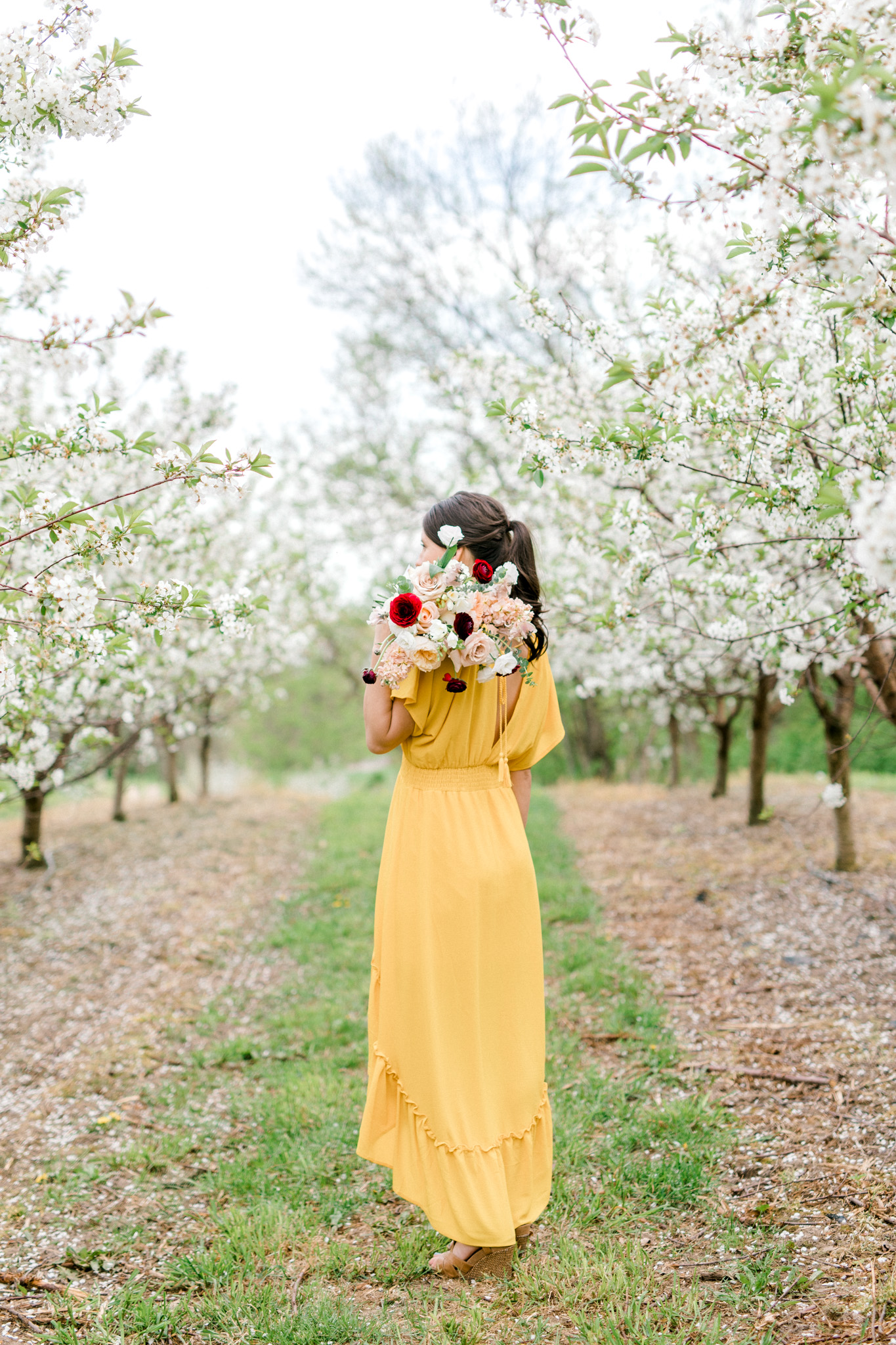 Spring Apple Blossom Engagement Session at the Orchard | Engagement Bouquet | Mustard Yellow Dress | What to Wear to Your Engagement Session | Grand Rapids Wedding Photographer