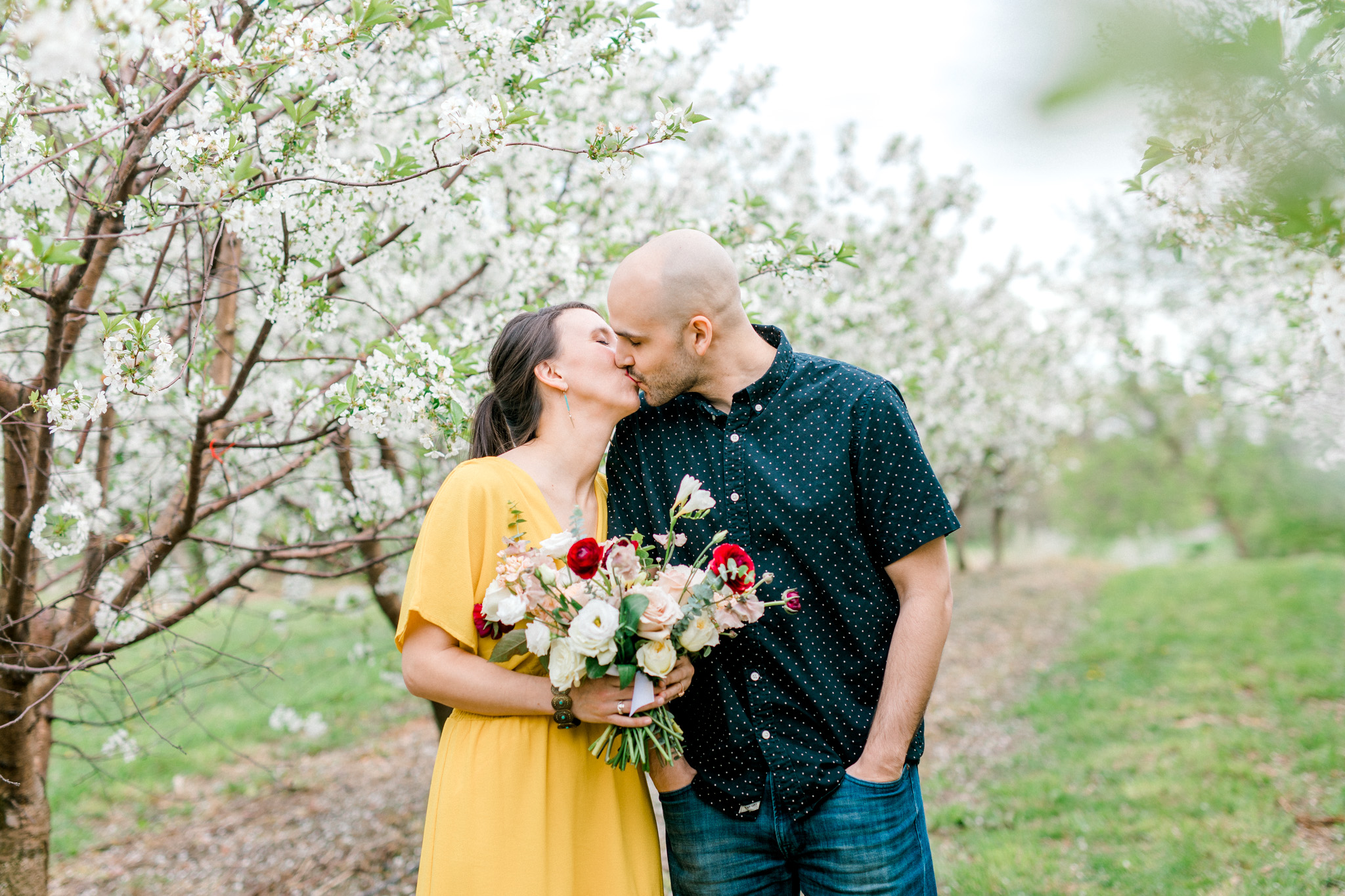 Spring Apple Blossom Engagement Session at the Orchard | Engagement Bouquet | Mustard Yellow Dress | What to Wear to Your Engagement Session | Grand Rapids Wedding Photographer