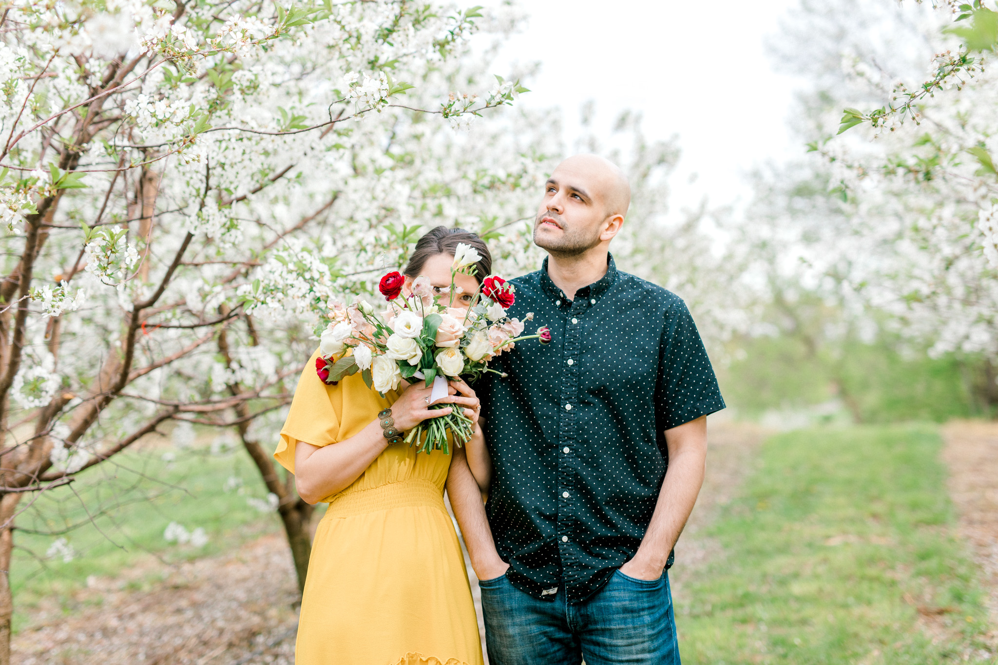 Spring Apple Blossom Engagement Session at the Orchard | Engagement Bouquet | Mustard Yellow Dress | What to Wear to Your Engagement Session | Grand Rapids Wedding Photographer