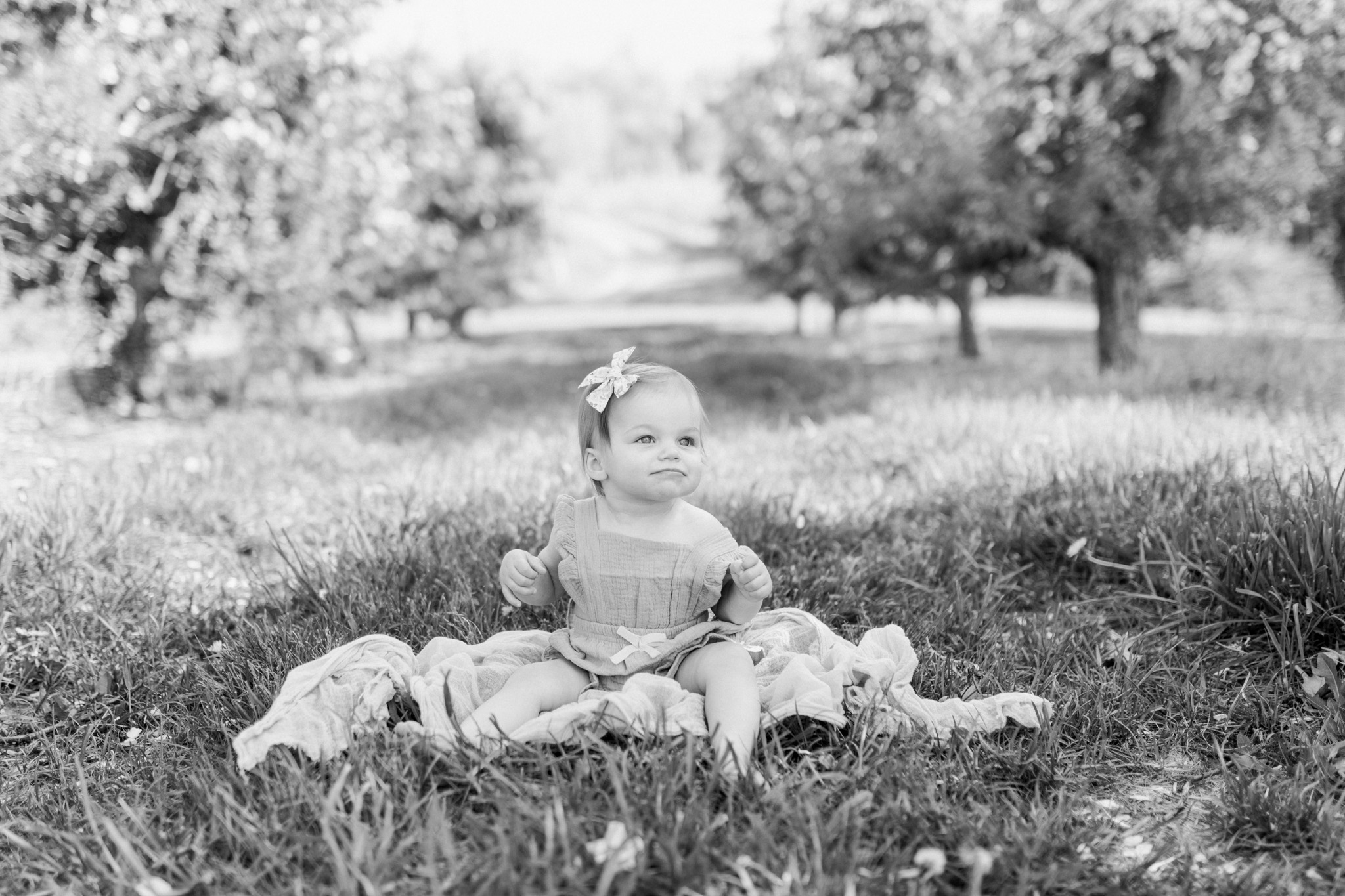Baby Girl One Year Birthday Session at the Orchard | Spring Apple Blossom Session | Lifestyle Photography | Light & Airy Photography | West Michigan Photographer