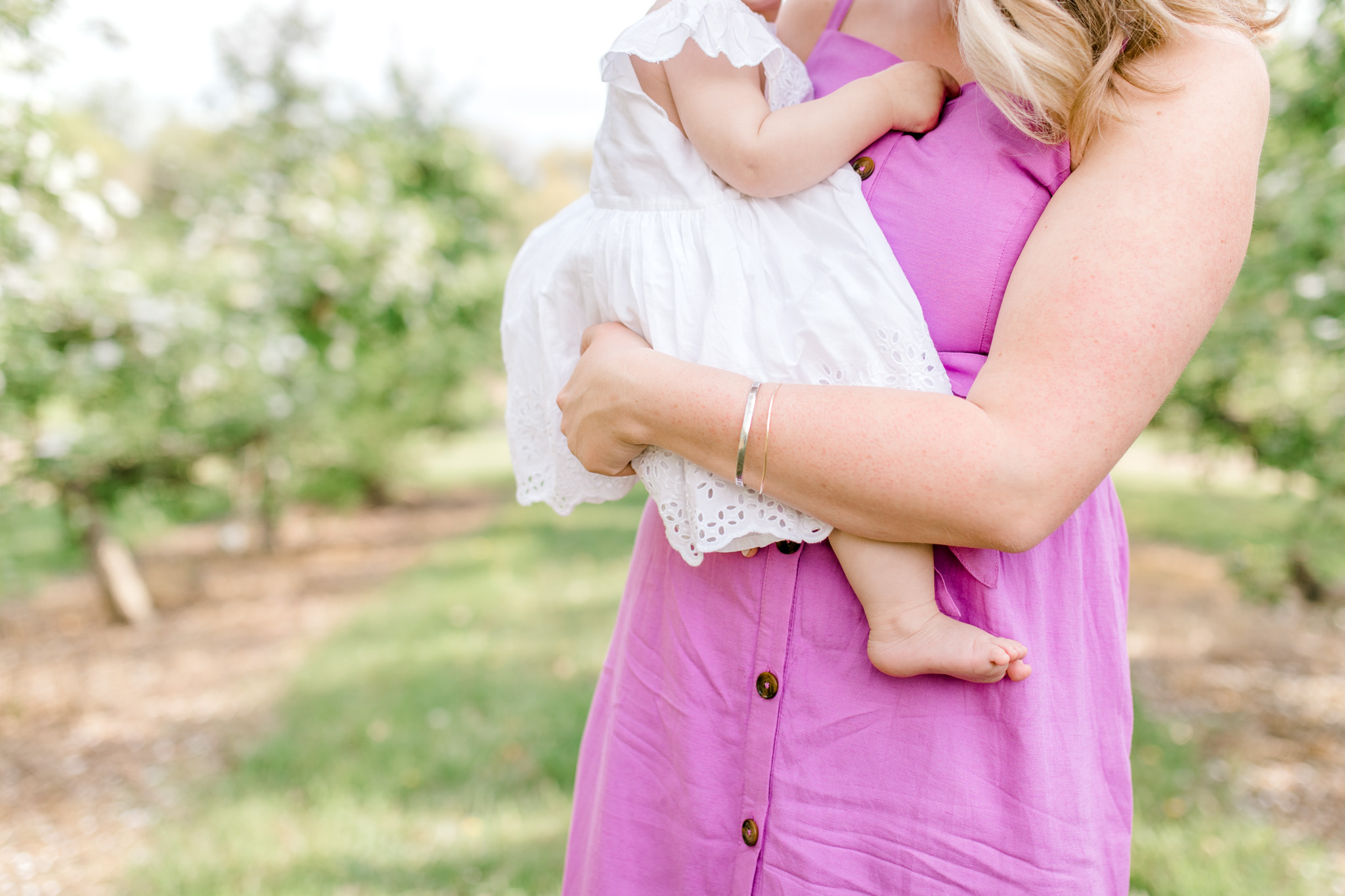 Baby Girl One Year Birthday Session at the Orchard | Spring Apple Blossom Session | Lifestyle Photography | Light & Airy Photography | West Michigan Photographer