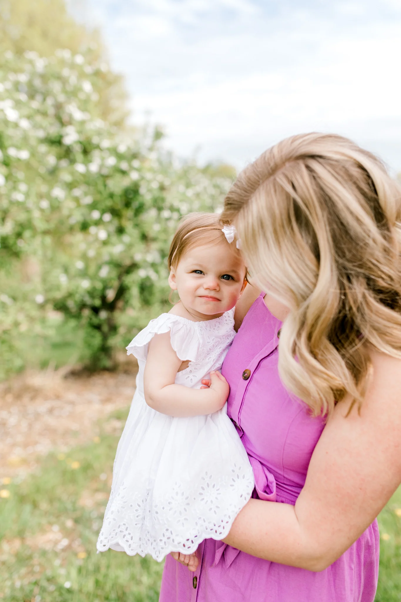 Baby Girl One Year Birthday Session at the Orchard | Spring Apple Blossom Session | Lifestyle Photography | Light & Airy Photography | West Michigan Photographer