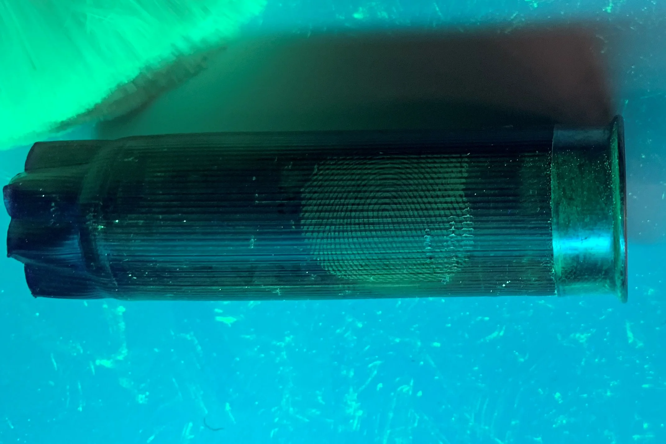 Detection of a latent print on a shotgun shell.