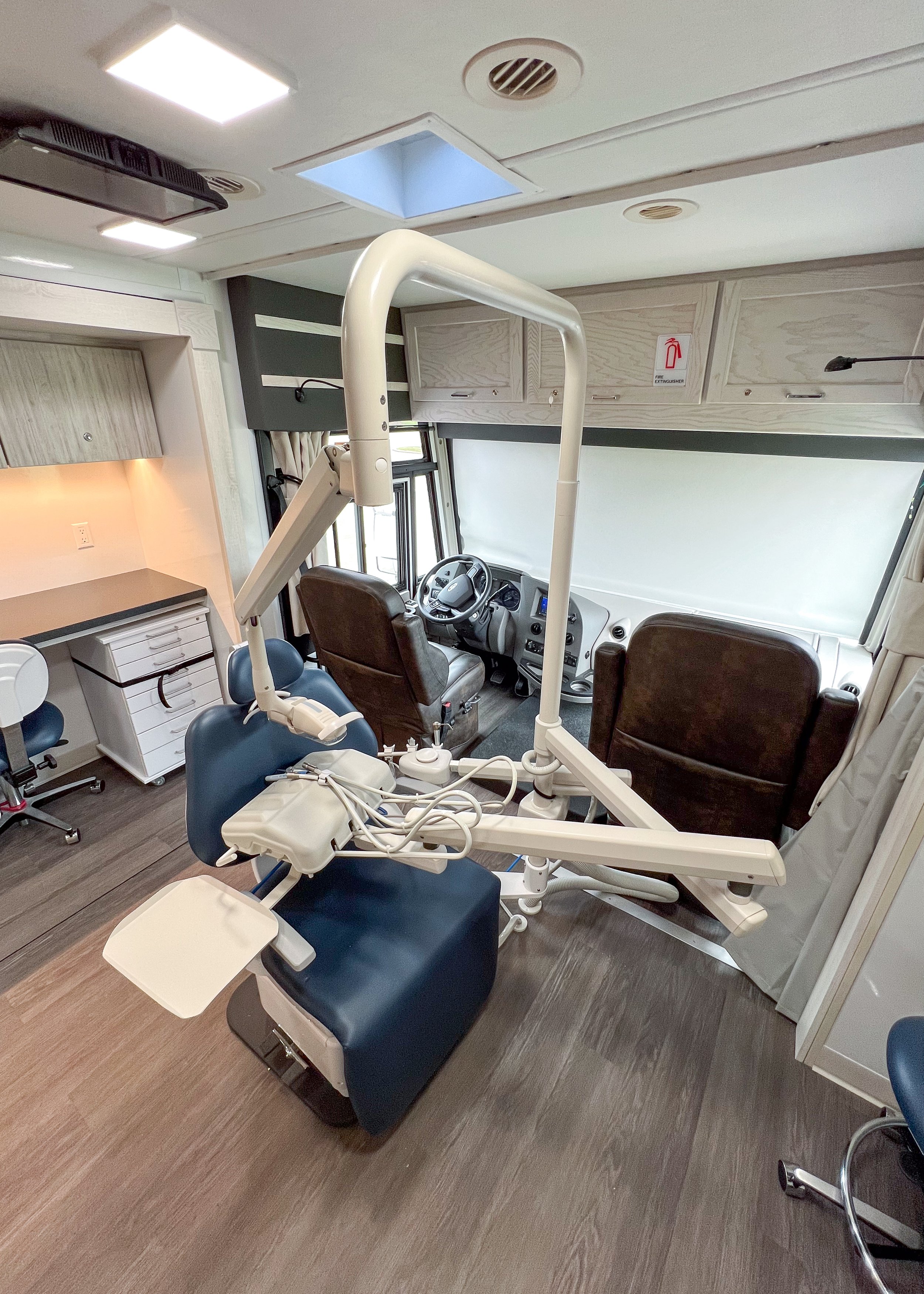  Dental chair (stowed for transport) and cab in background (with windshield privacy shade down). 