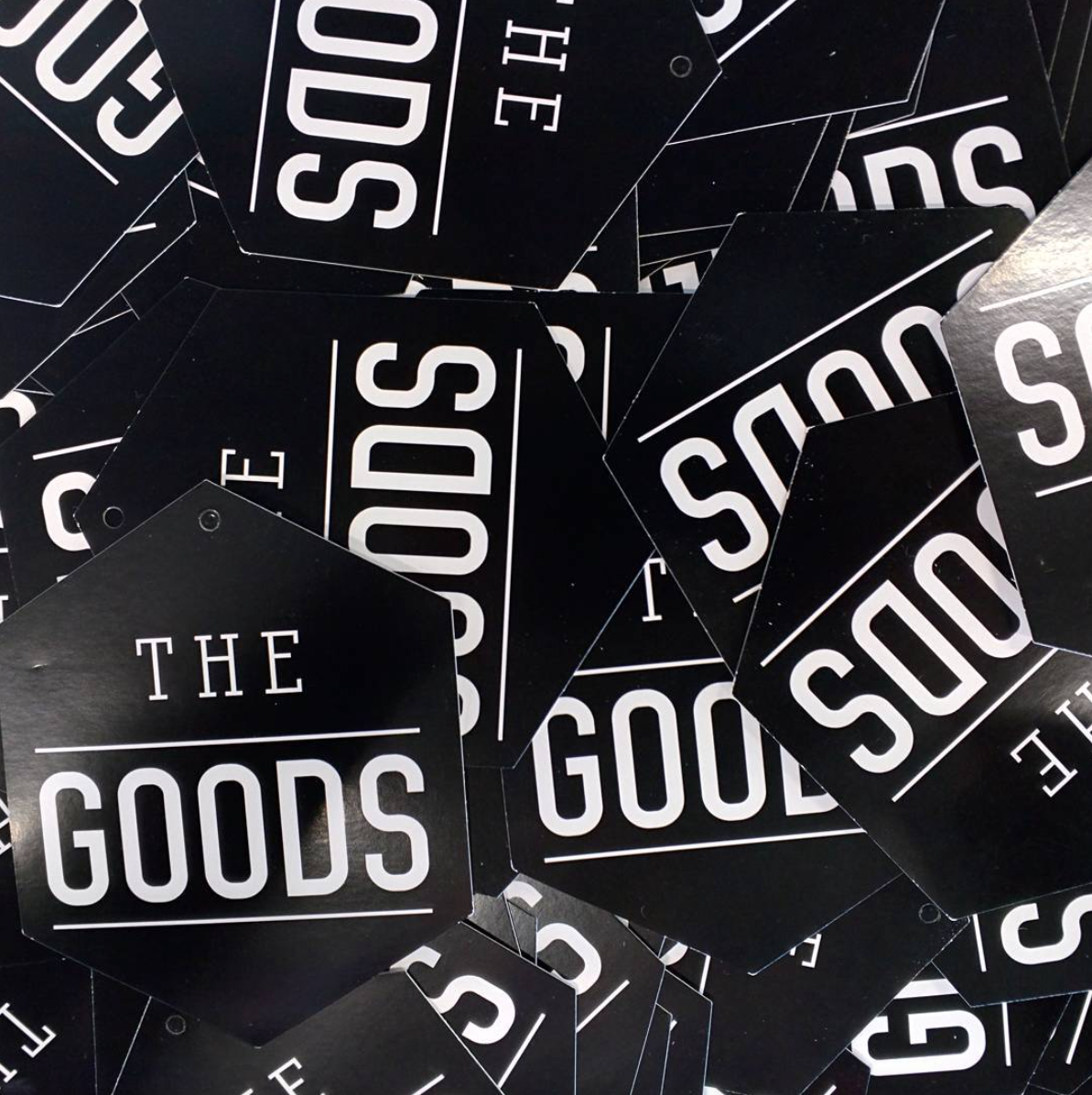 The Goods logo has been used as a design for product tags; the product information is printed on the backside. 