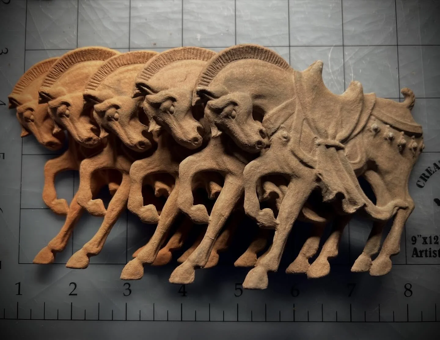 The cast paper horses are all trimmed up and ready for the next phase. Even though I&rsquo;m only using one horse in my final piece, I really love them all stacked up like this! I will probably frame the other four in simpler frames and offer them on