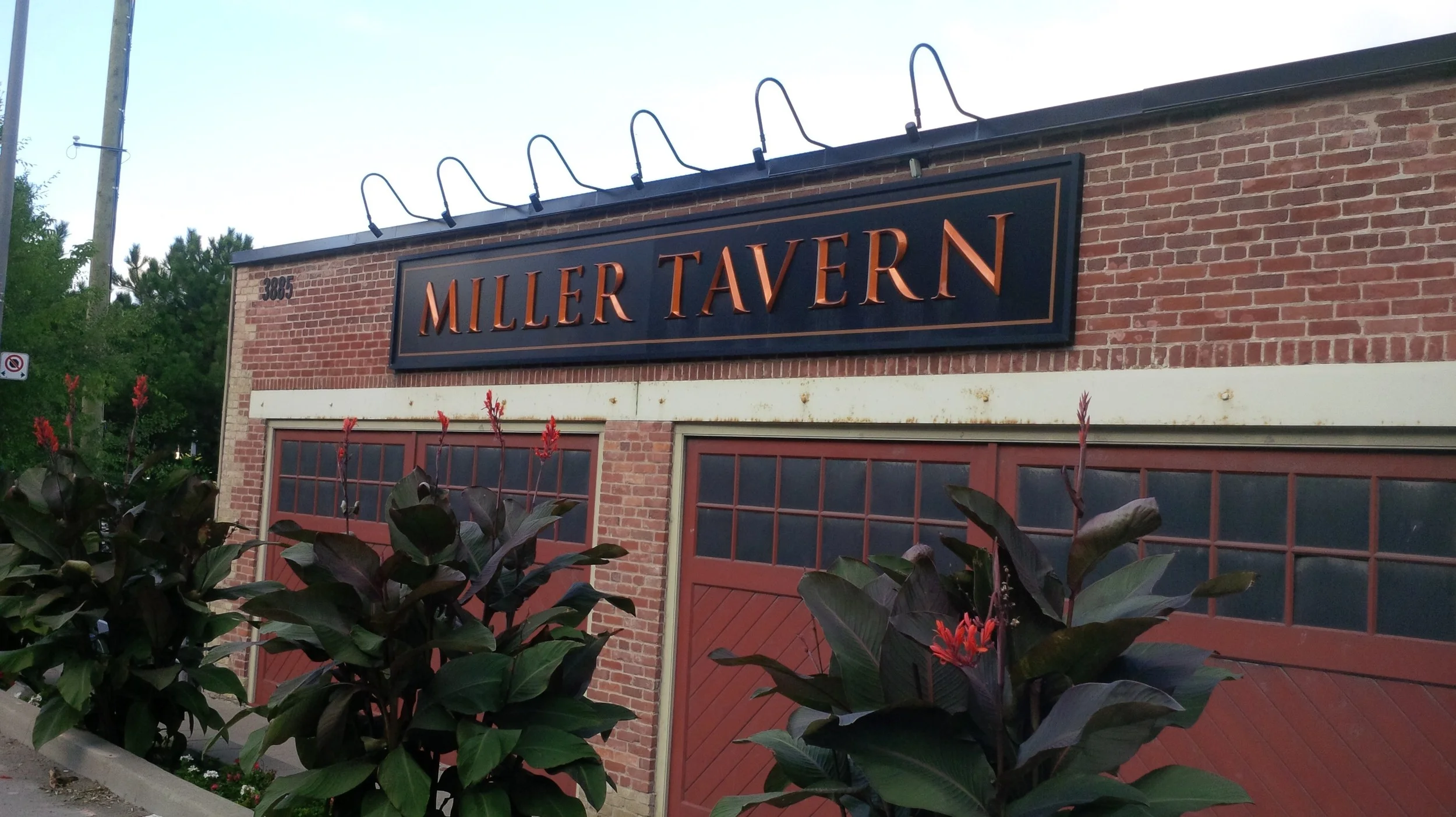 Picture of large restaurant sign from sidewalk