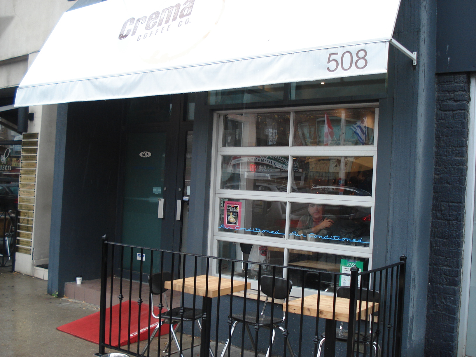 Picture of exterior of coffee shop. Red StopGap ramp outside of door