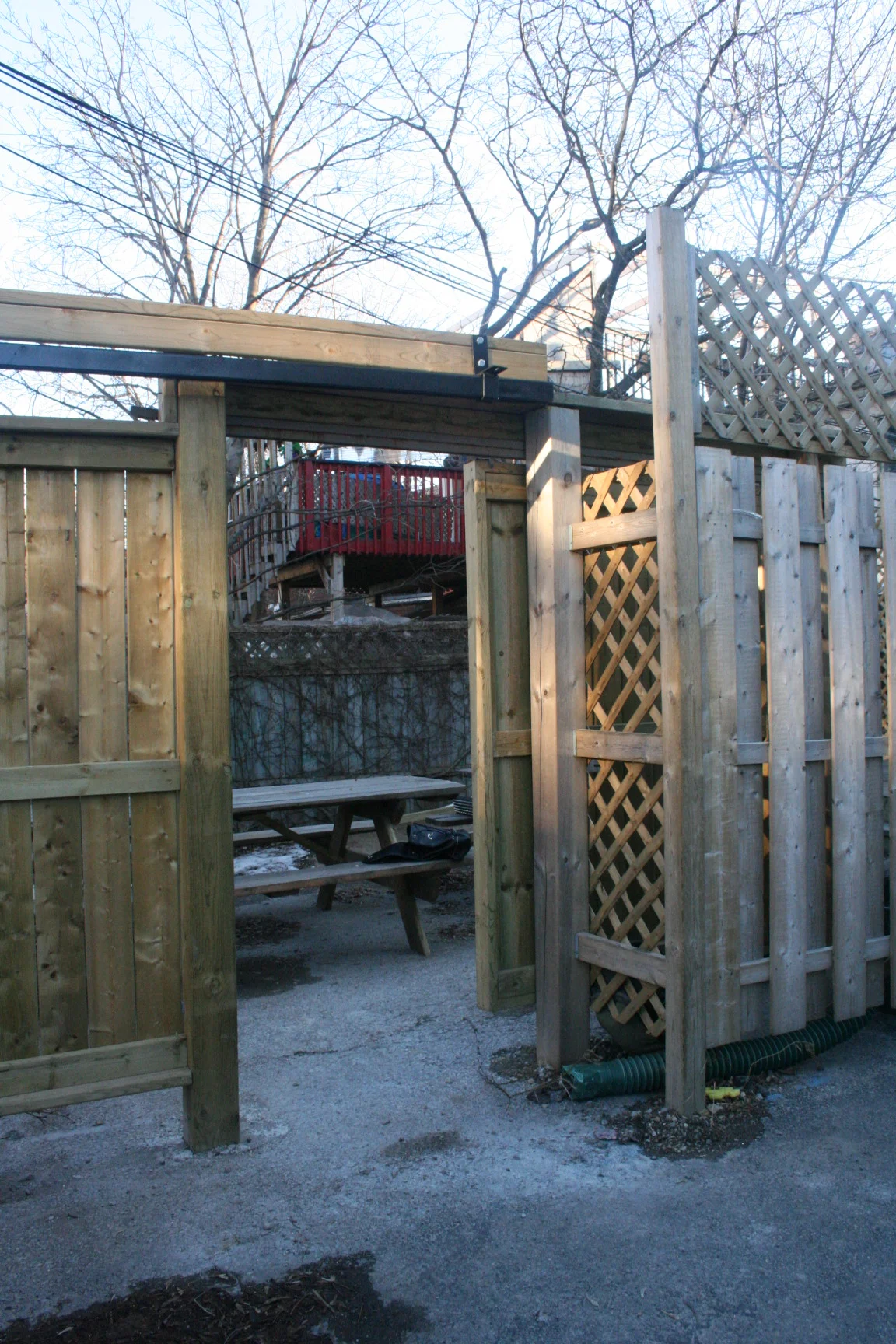 image of the accessible wooden ramp at the back of the building, where the patio is located