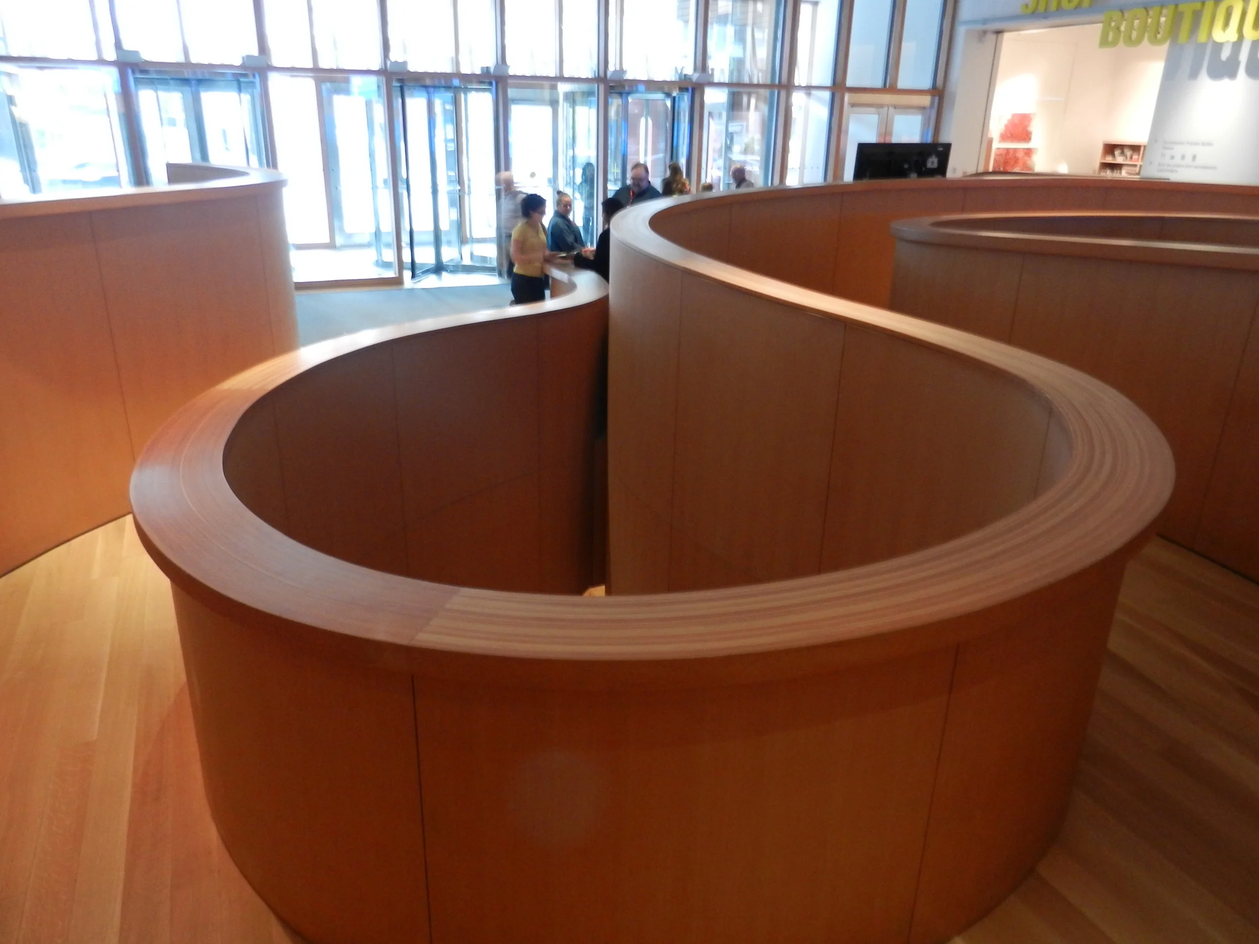 Picture of the accessible winding wooden ramp to enter.