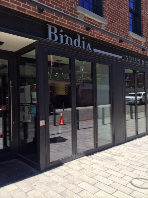 Picture of accessible entrance with automatic button.