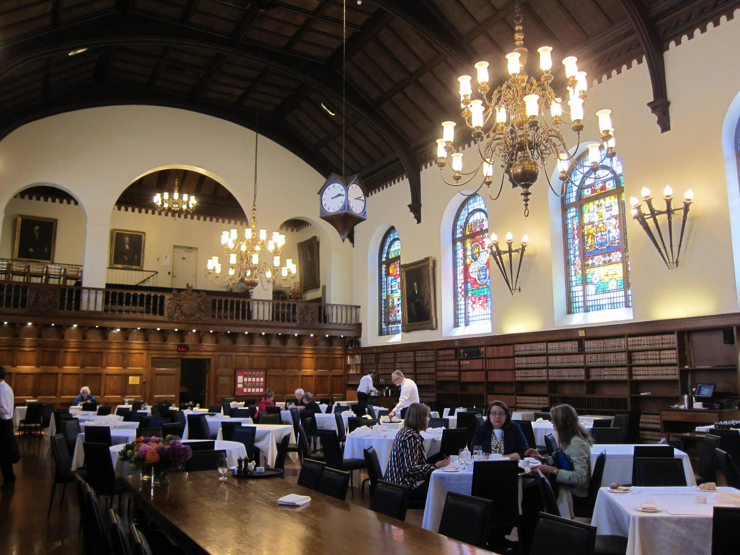 Picture of interior of restaurant. Many standard height tables.