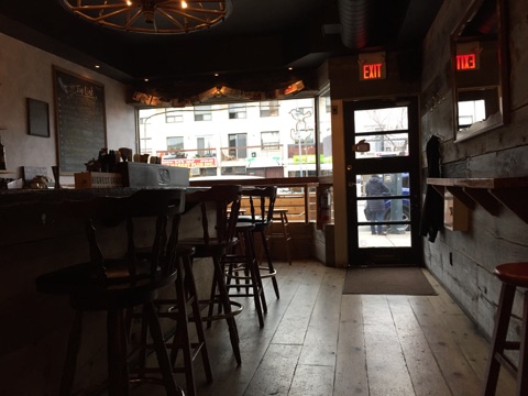 Picture of bar and entrance of The Wren from the inside.