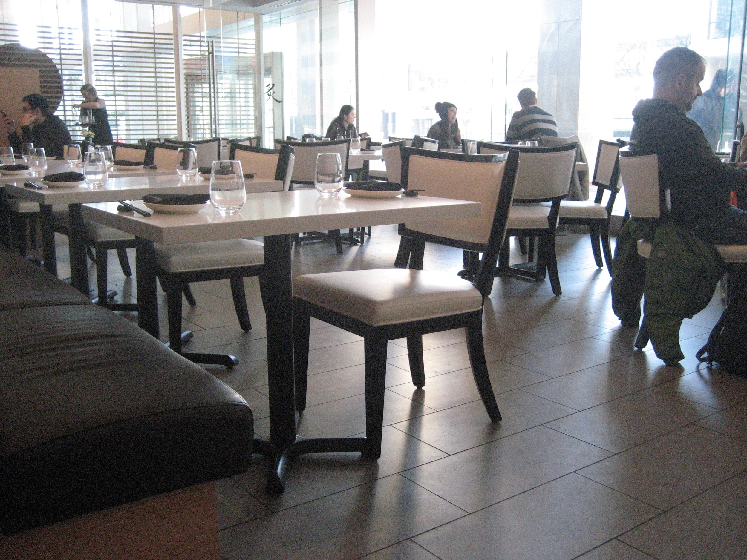 Picture of various standard height tables inside Miku Toronto