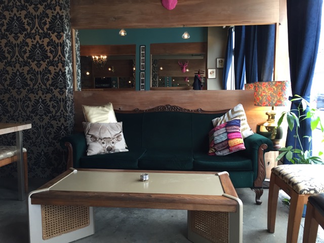 Picture of green couch and coffee table for seating