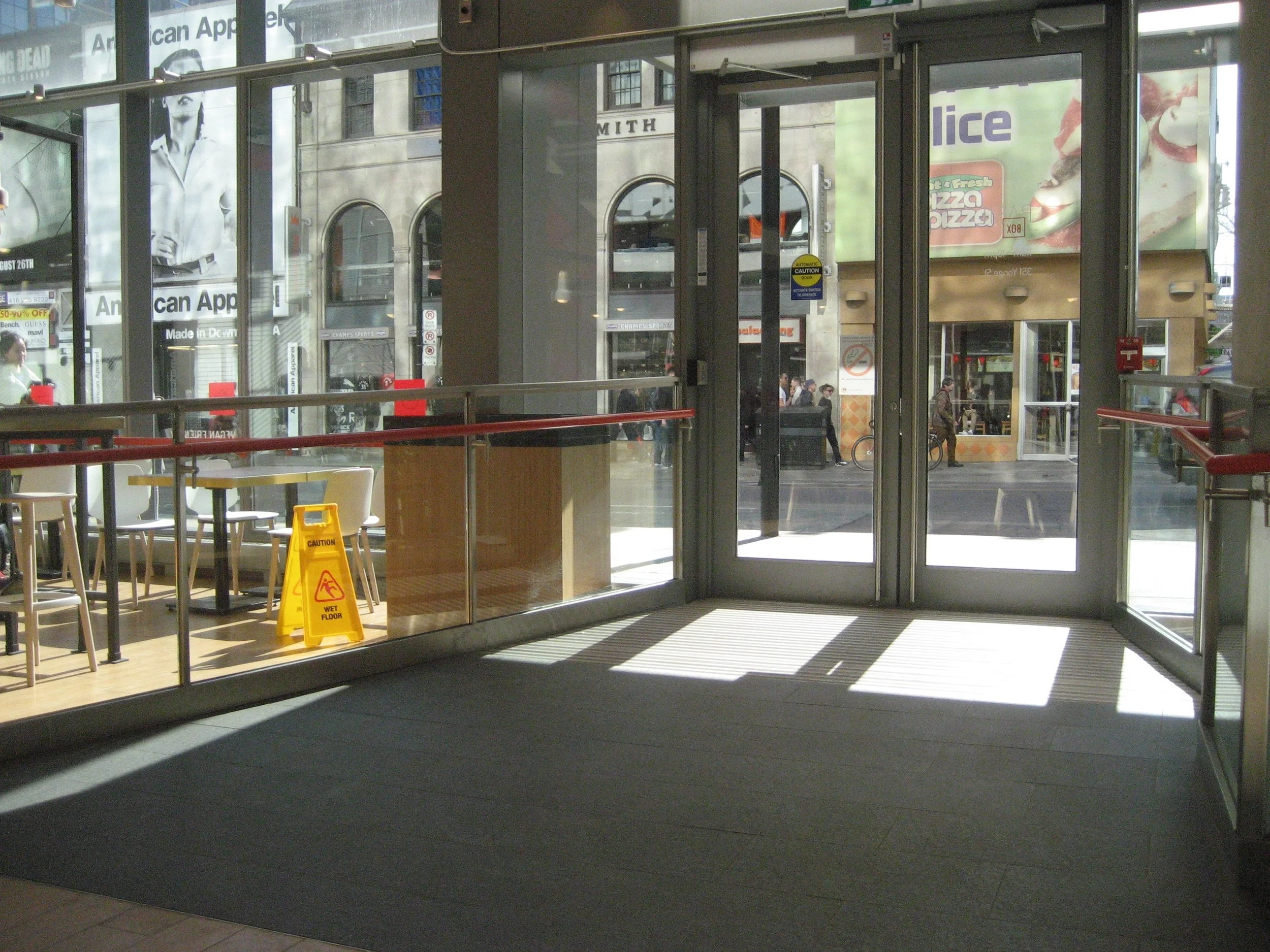 Picture of the accessible entrance from the inside showing where the automatic door opener is located.