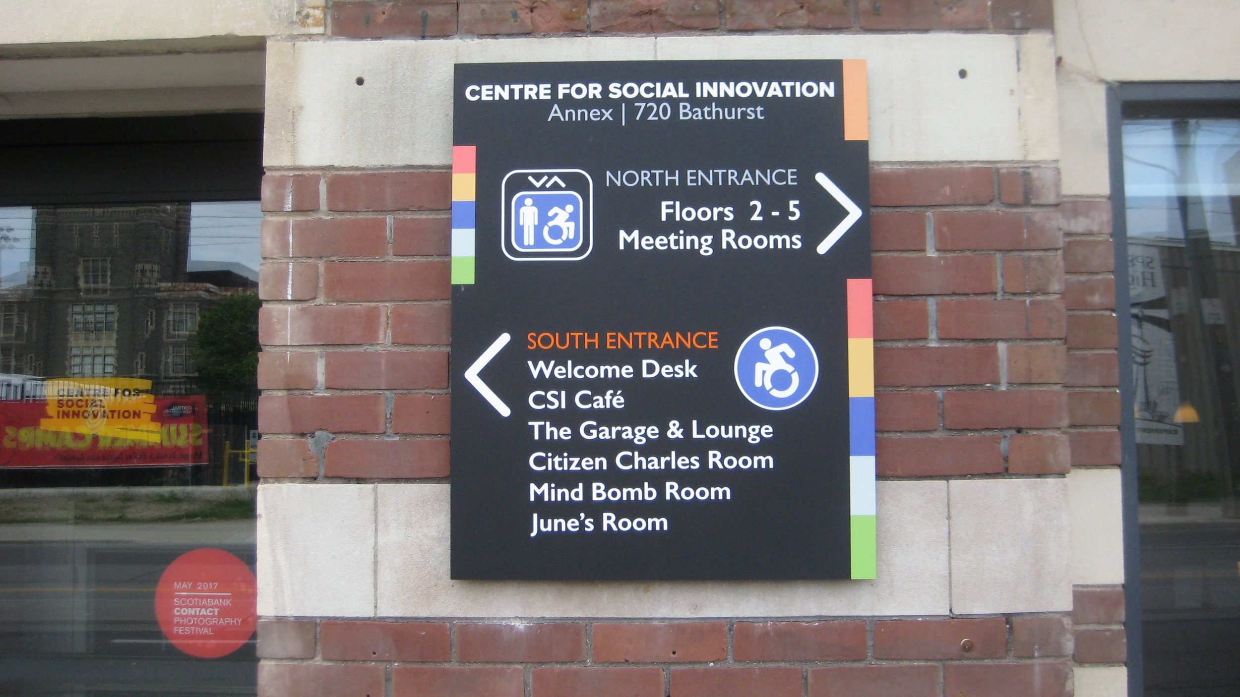 Picture of the way finding sign at the front of the building regarding accessibility features