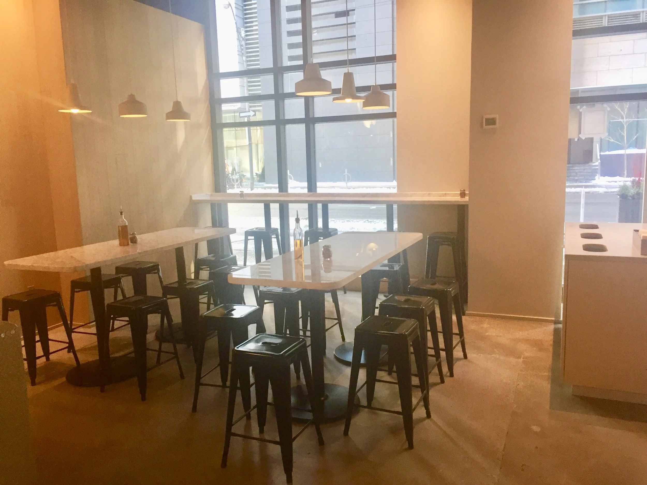 Picture of bar height tables in Pi Co.