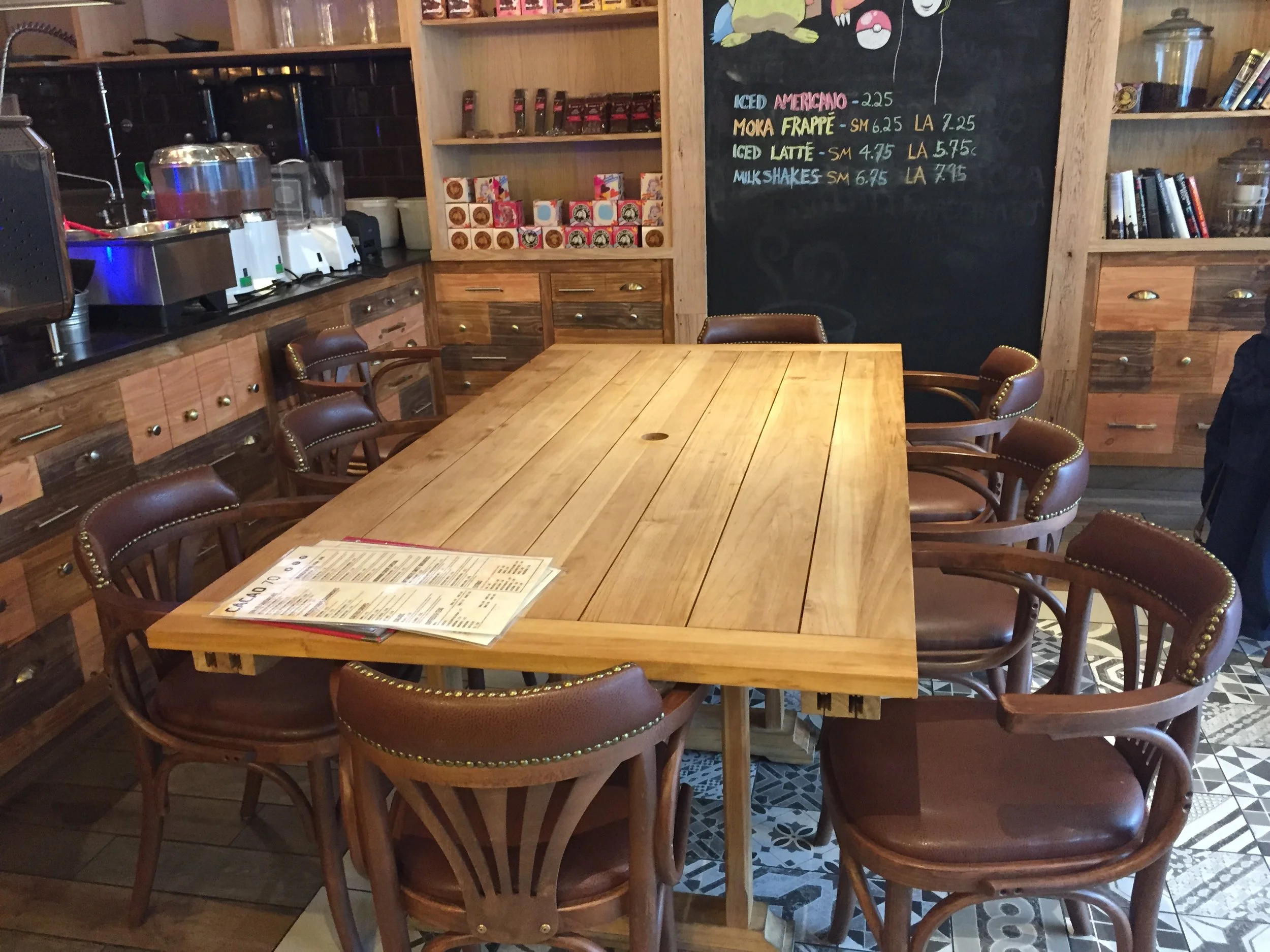 Picture of large standard height table with chairs at Cacao 70